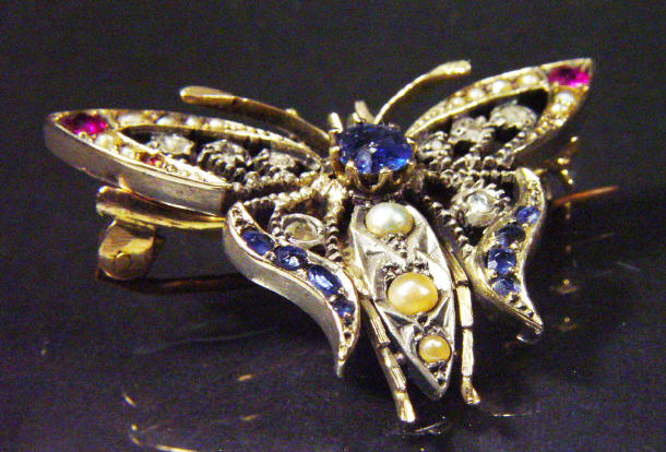 Appraisal: Victorian gold butterfly brooch set with diamonds rubies sapphires and