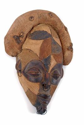 Appraisal: A Chokwe style mask with coloured reeded panel decoration metal