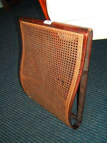 Appraisal: An early th Century mahogany and caned lumbar support or