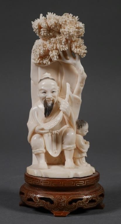 Appraisal: Nice antique Chinese carving of a fisherman and a child