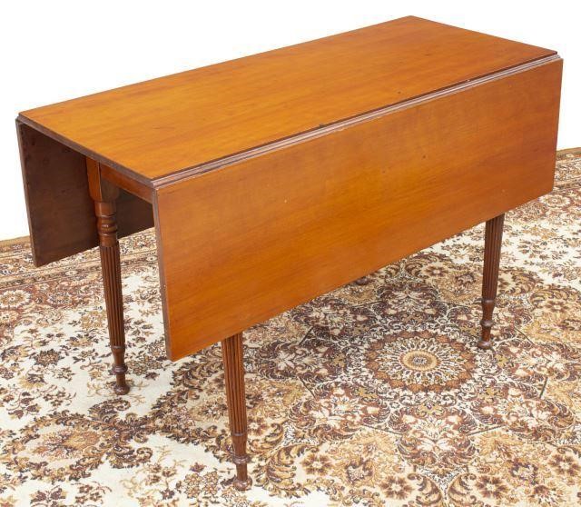 Appraisal: American Sheraton cherry Pembroke table with drop leaves rising on