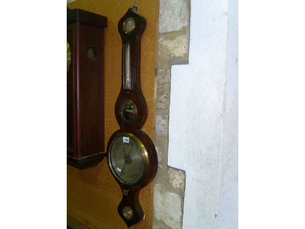 Appraisal: A th century rosewood wheel barometer with silvered dials