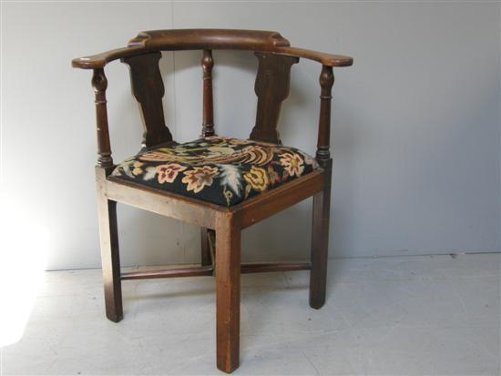 Appraisal: George III mahogany corner chair with shaped and turned splats