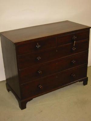 Appraisal: A GEORGE III MAHOGANY CHEST of two short over three