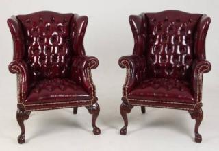 Appraisal: PAIR OF TUFTED LEATHER MAHOGANY WING CHAIRS PAIR OF BLACKBERRY