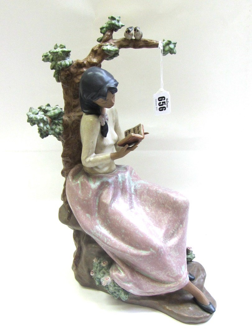 Appraisal: A Lladro porcelain figure modelled as a young girl reading