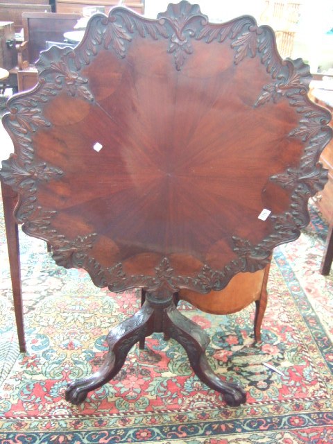 Appraisal: A George III style carved and radially veneered mahogany tilt