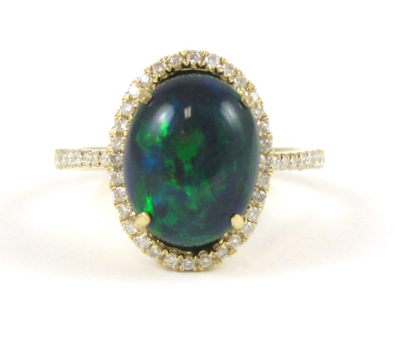 Appraisal: BLACK OPAL AND FOURTEEN KARAT GOLD RING with round-cut diamonds