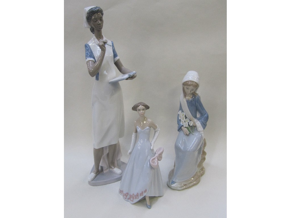 Appraisal: Three Lladro figures of women to include a nurse