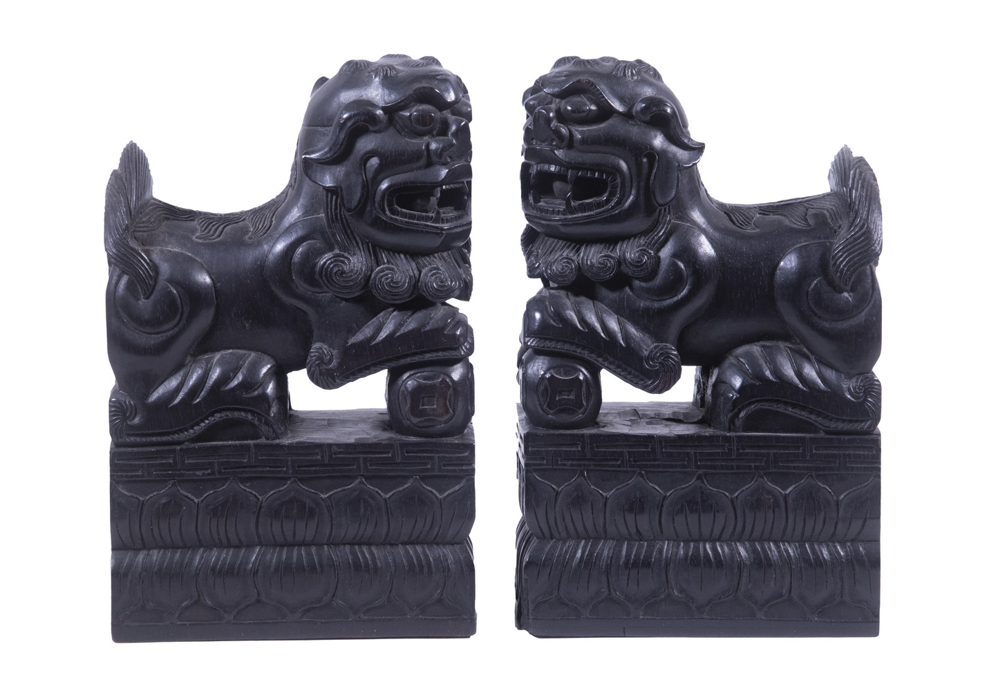 Appraisal: PR CHINESE WOODEN FOO DOGS Pair of Carved and Ebonized