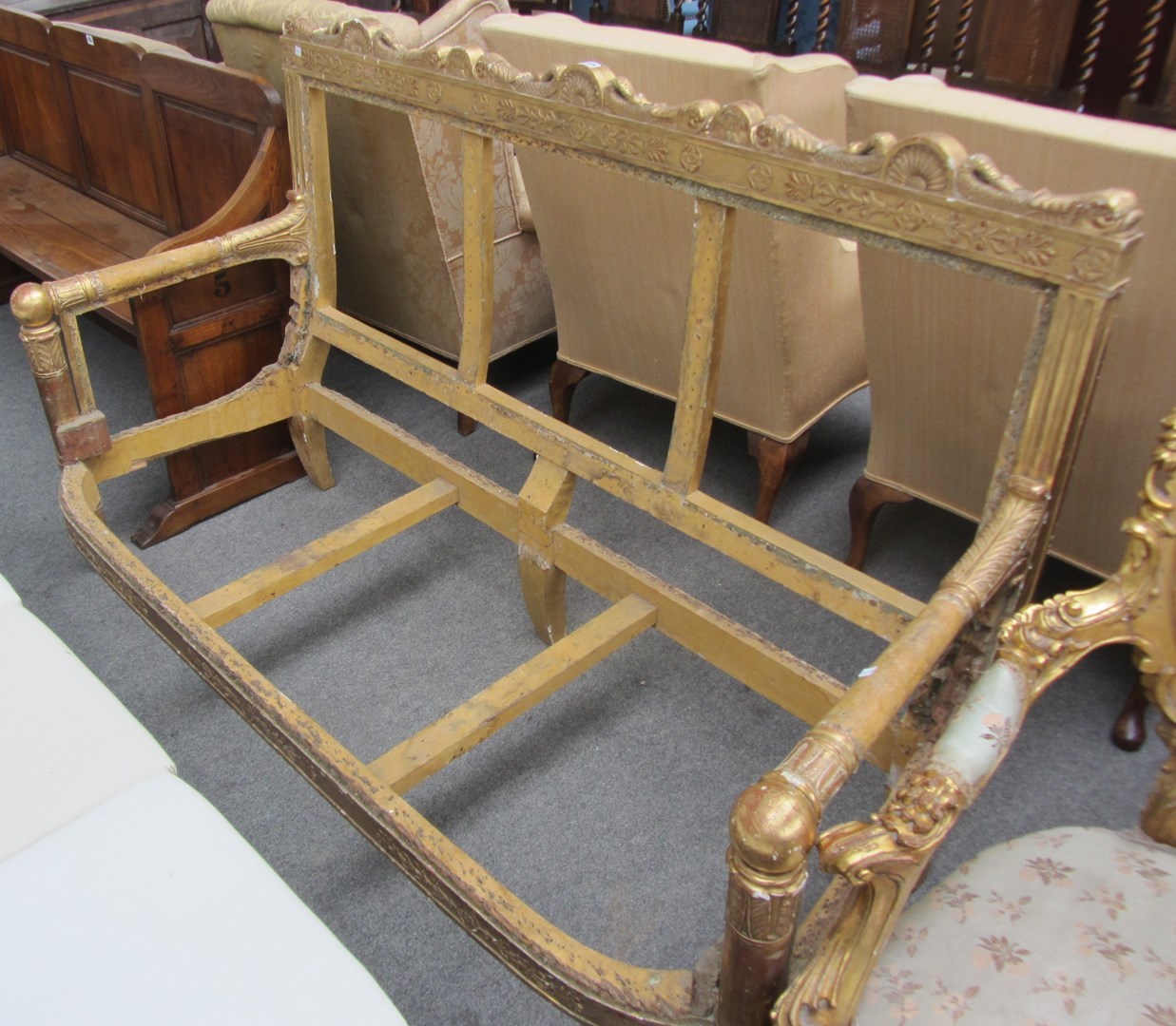 Appraisal: A th century gilt framed sofa frame with carved serpent