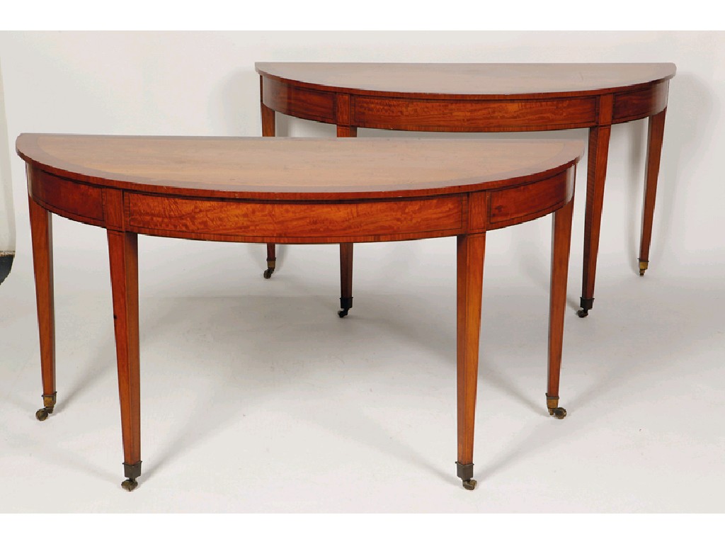 Appraisal: A PAIR OF SATINWOOD DEMI-LUNE PIER TABLES in the manner