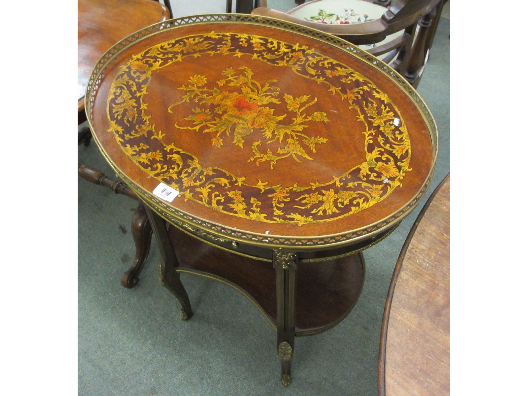 Appraisal: A mahogany inlaid and brass two tier table