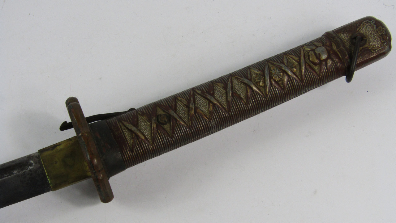 Appraisal: A WWII Japanese sword with an aluminium grip blade numbered