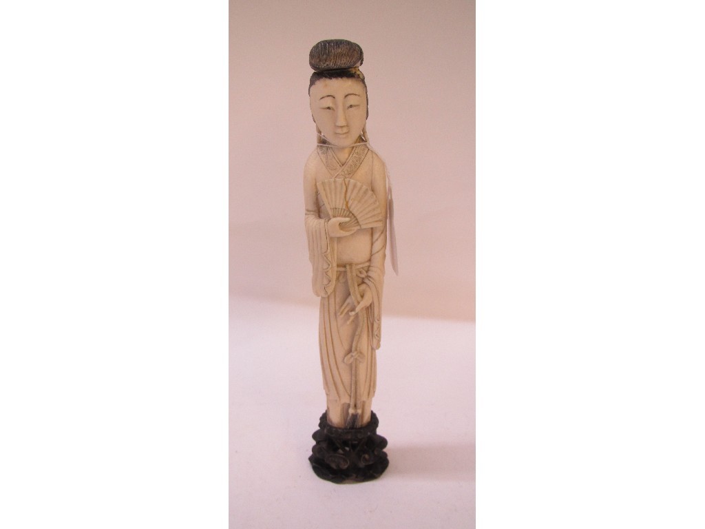 Appraisal: Carved ivory figure female with a fan