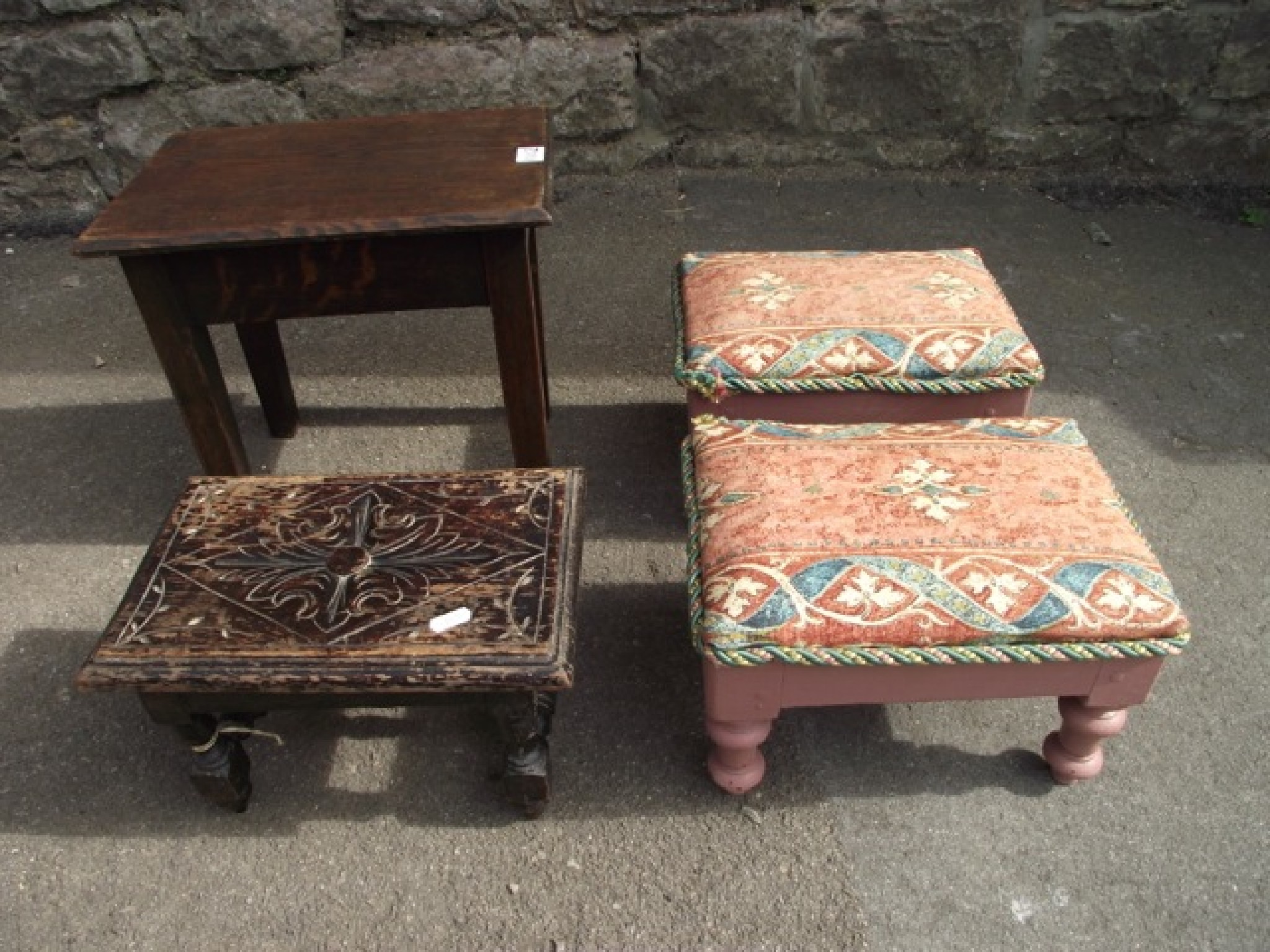 Appraisal: A pair of small foot stools with rectangular upholstered tops