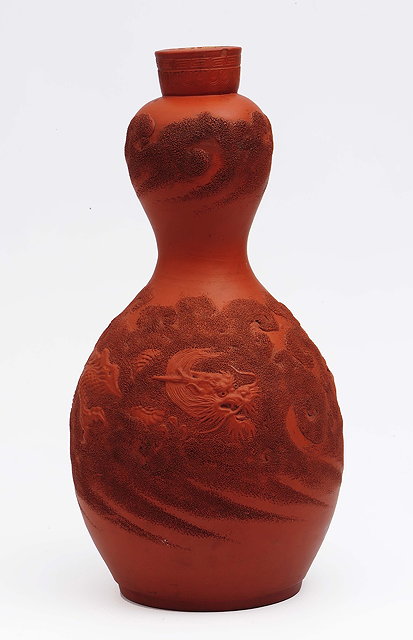 Appraisal: A Chinese Yixing double gourd vasecirca with dragon and cloud