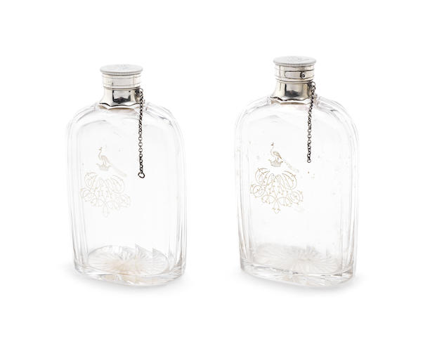 Appraisal: A pair of Victorian silver topped decanters flasks possibly by