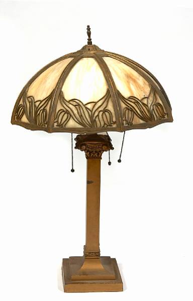 Appraisal: An American bronze and slag glass table lamp height in