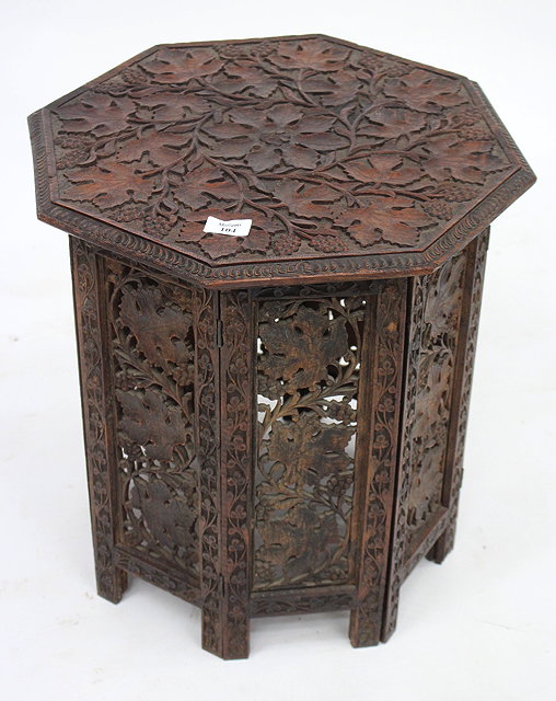 Appraisal: A KASHMIRI HARDWOOD OCCASIONAL TABLE the octagonal top with caved