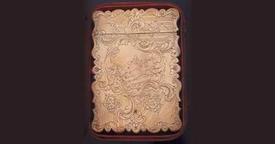 Appraisal: A Victorian engine turned card case with an engraved vinaigrette