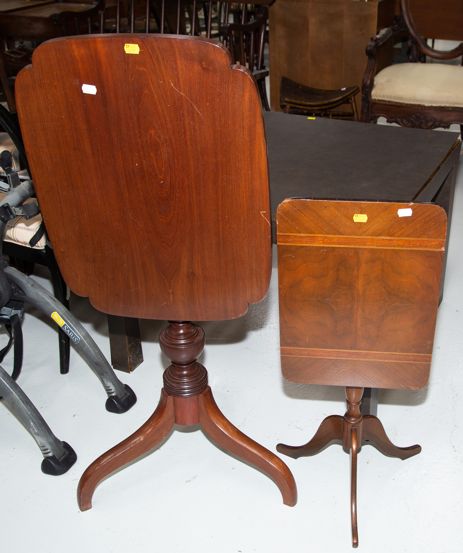 Appraisal: TWO MAHOGANY TILT TOP LAMP TABLES Comprising a Federal style