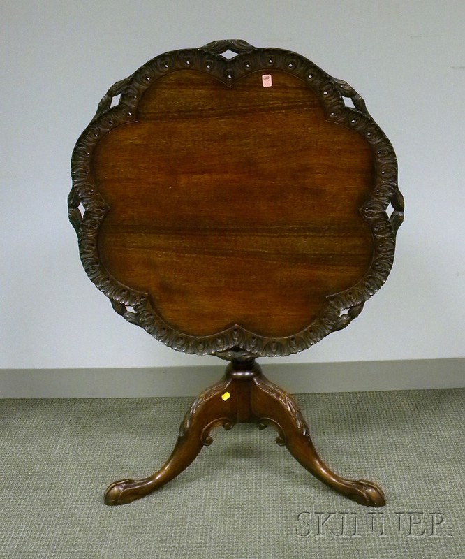 Appraisal: Chippendale-style Carved Mahogany Tilt-top Tea Table with pieced rim dia