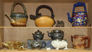 Appraisal: Two Shelves of Tea Pots lot of Two shelves of