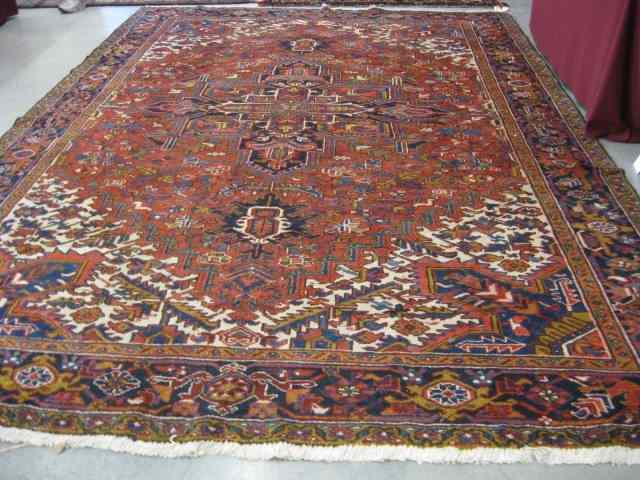 Appraisal: Heriz Persian Handmade Room Size Rug grand central medallion geometrics