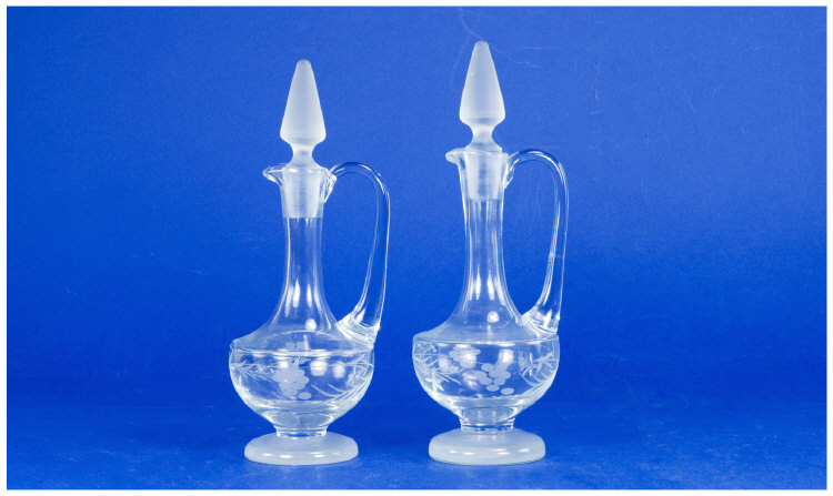 Appraisal: Pair Of Etched Glass Oil Pourers Frosted Stoppers Height Inches