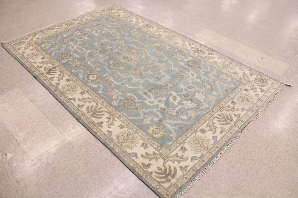 Appraisal: A CONTEMPORARY HAND KNOTTED ORIENTAL CARPET Indo-Persian overall cream and