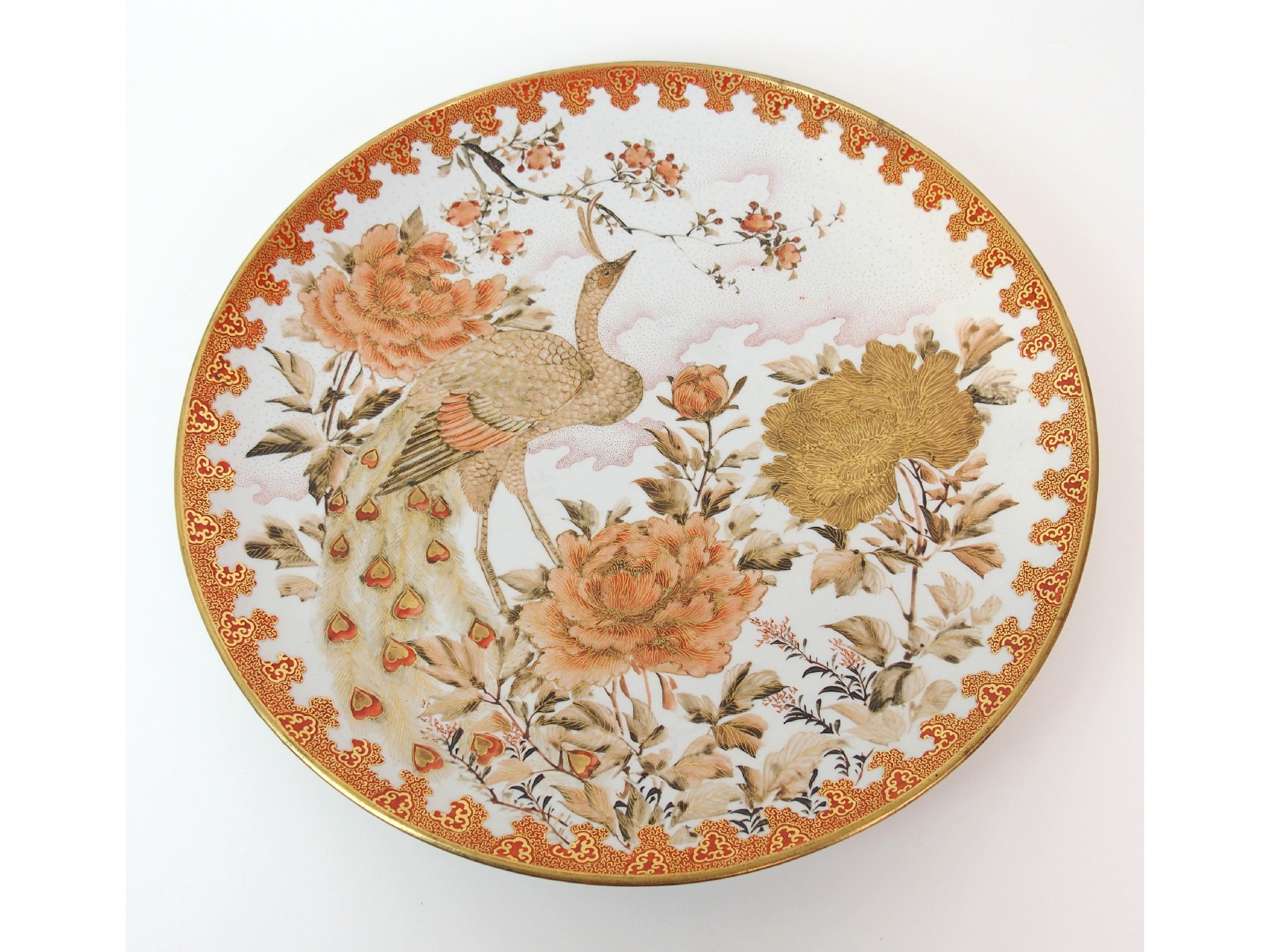 Appraisal: A Kutani dishpainted with a peacock amongst peonies and blossoming