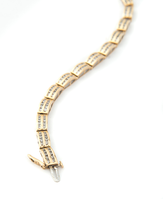 Appraisal: KARAT YELLOW GOLD AND DIAMOND TENNIS BRACELET Composed of nineteen