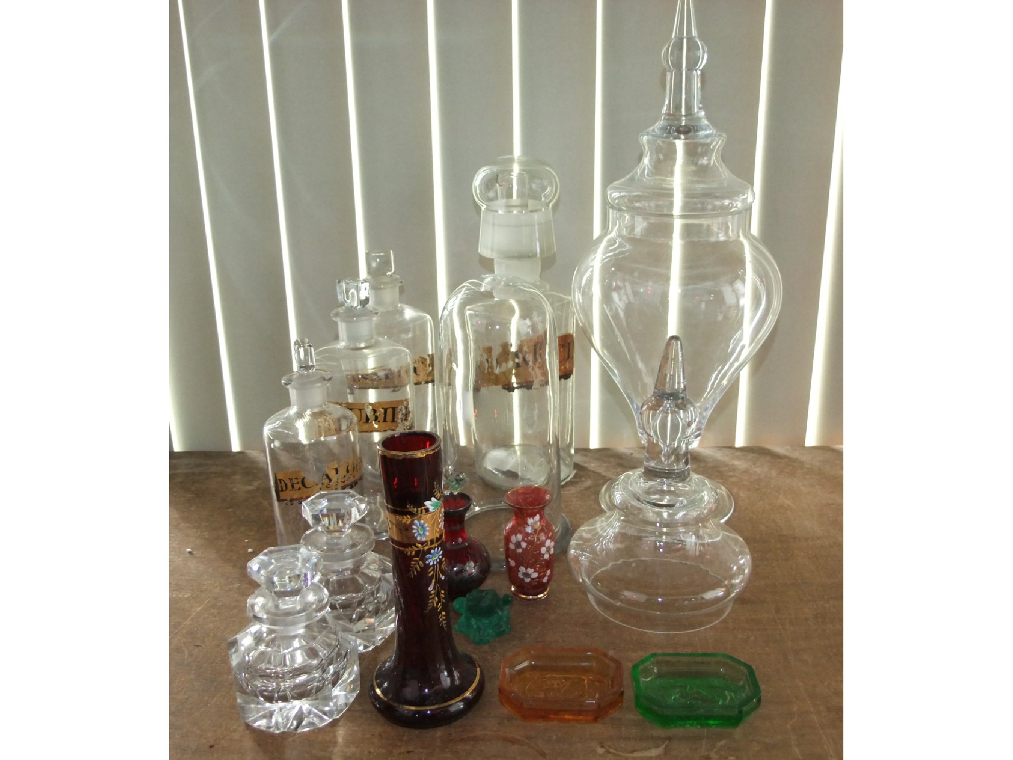 Appraisal: Four various antique clear glass chemist medicinal bottle of varying