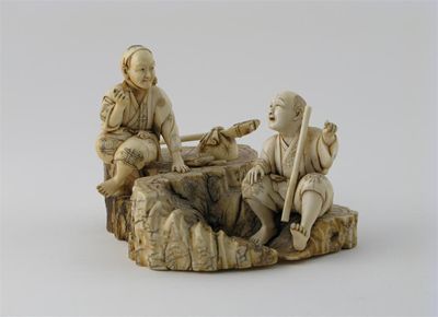 Appraisal: A Japanese ivory okimono of two lumberjacks with their axes