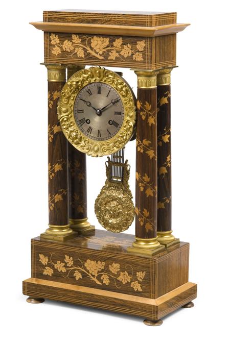 Appraisal: A French marquetry rosewood and gilt metal mounted portico clock