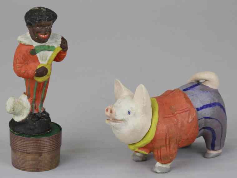 Appraisal: WELL DRESSED PIG MINSTREL MAN CANDY CONTAINERS Germany pig dressed