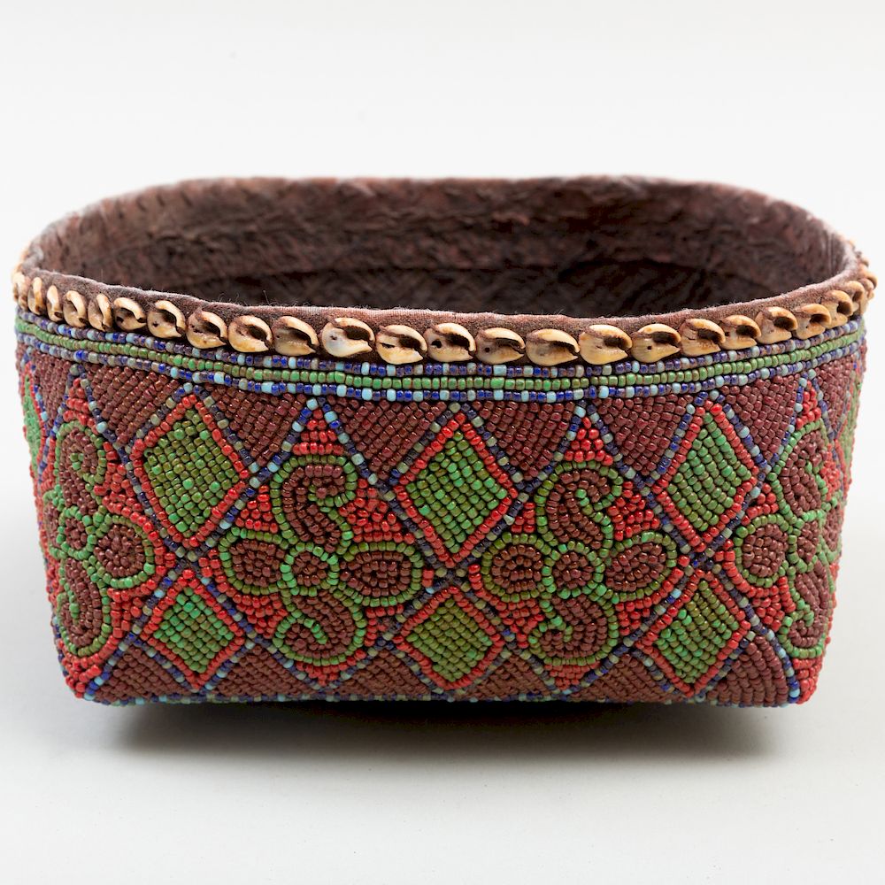 Appraisal: Polychrome Beaded and Shell Basket Interior lined in pitch x