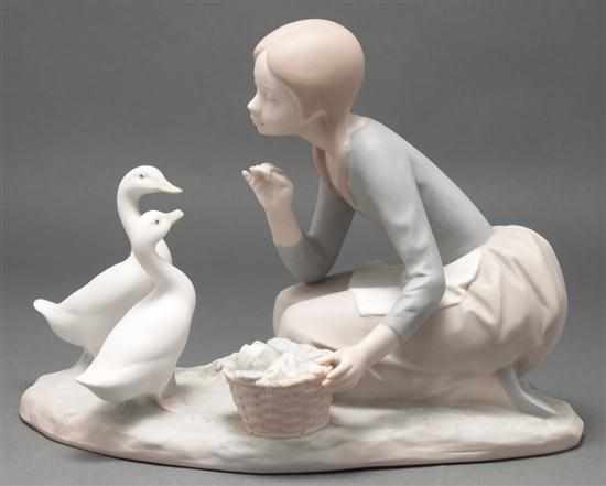 Appraisal: Lladro bisque figural group of a woman feeding geese blue