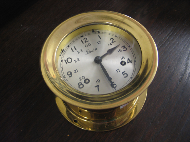 Appraisal: AN AMERICAN BRASS SHIP'S CLOCK The round heavy brass case