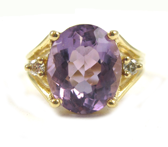 Appraisal: AMETHYST DIAMOND AND FOURTEEN KARAT GOLD RING with two round-cut