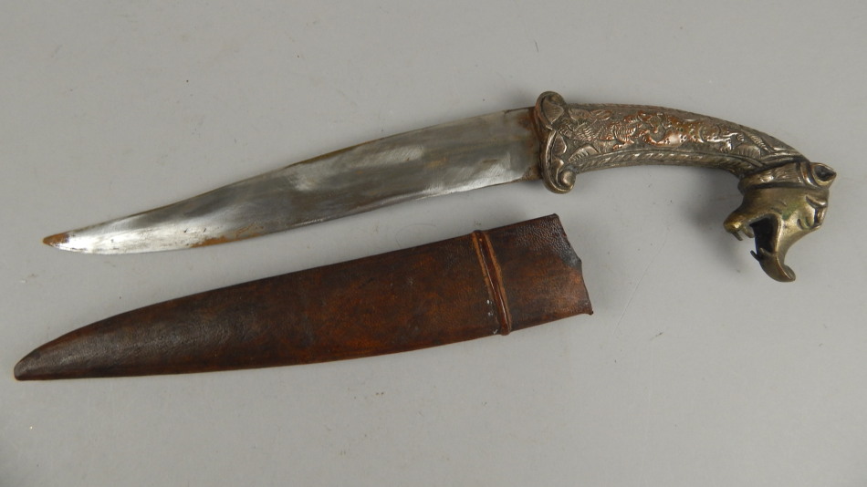 Appraisal: A Middle Eastern dagger with a shaped blade the plated