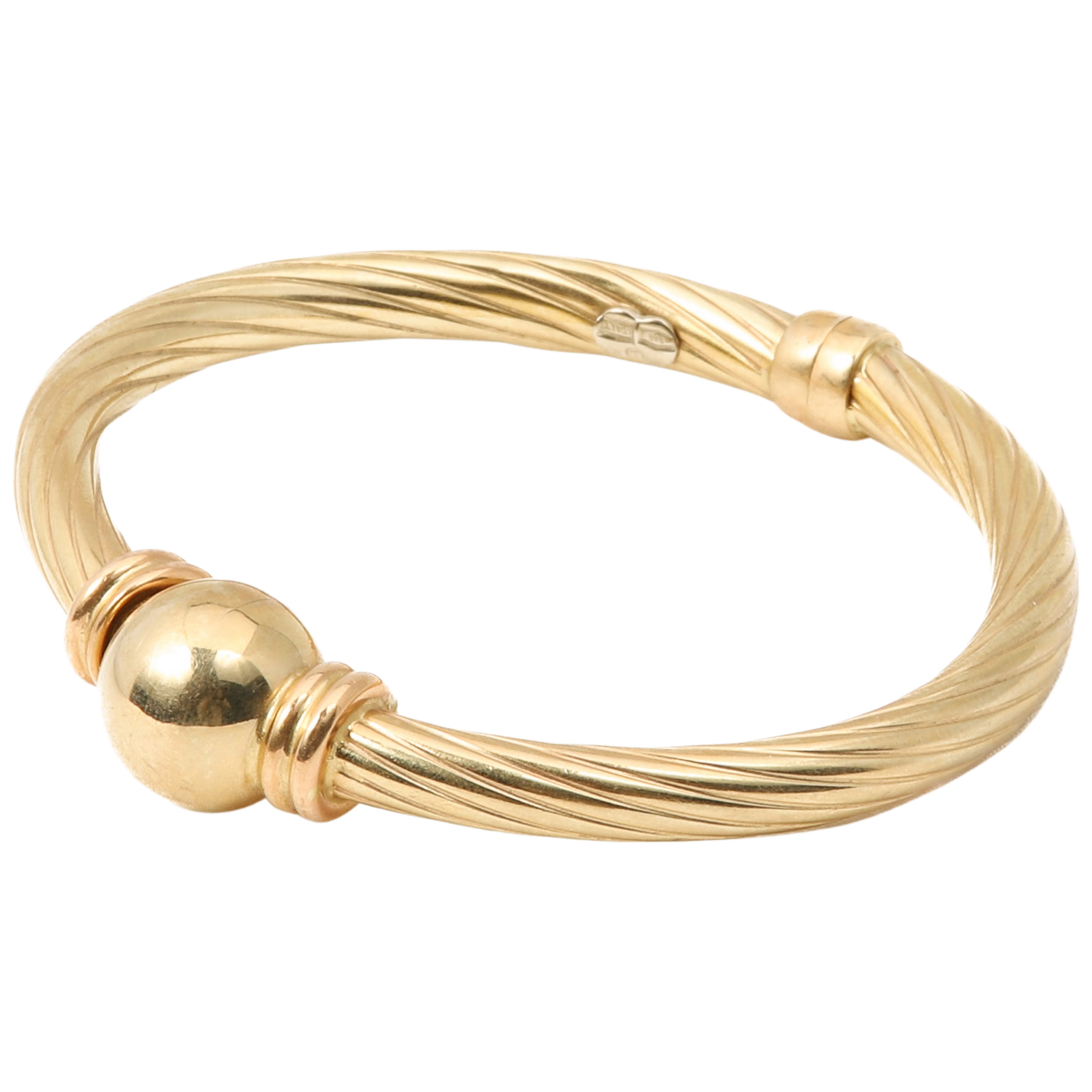 Appraisal: K hinged bangle in hollow twist design with ball at