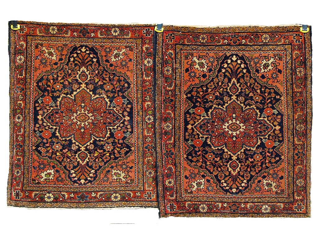 Appraisal: Pair of Persian 'American' Sarouk mats nd quarter th century