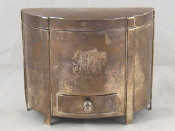 Appraisal: An unusual silver cigarette dispenser formed as a demi lune