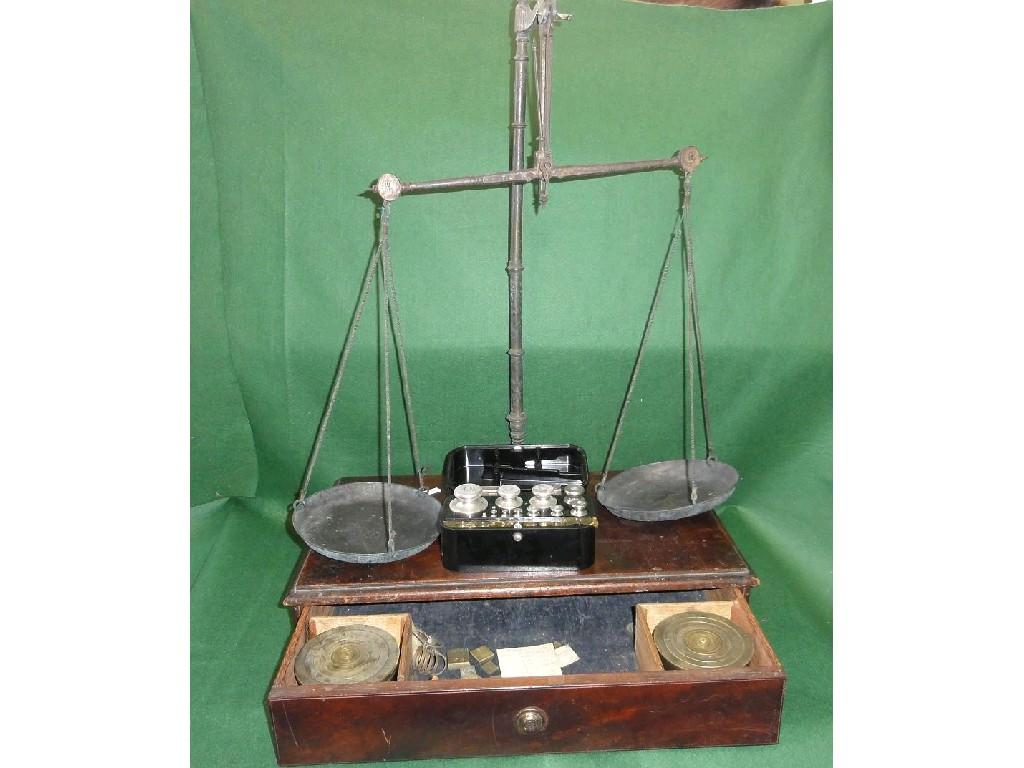 Appraisal: A th century mahogany cased set of balance scales fitted