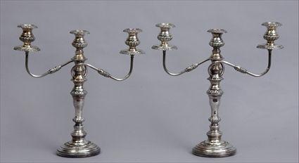 Appraisal: PAIR OF ENGLISH SILVER-PLATED CANDLESTICKS WITH REMOVABLE THREE-LIGHT ARMS Each