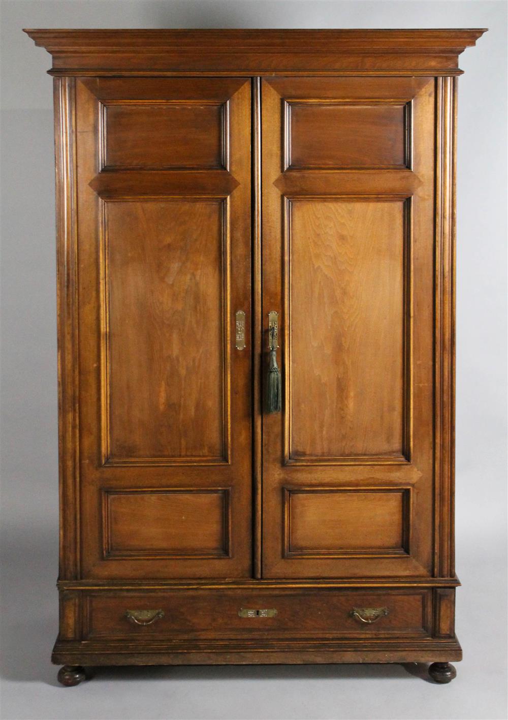 Appraisal: LATE TH C PANELED WALNUT ARMOIRE having a wide flat