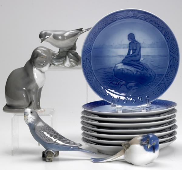 Appraisal: ROYAL COPENHAGEN Bird figurine and commemorative Christmas plates together with