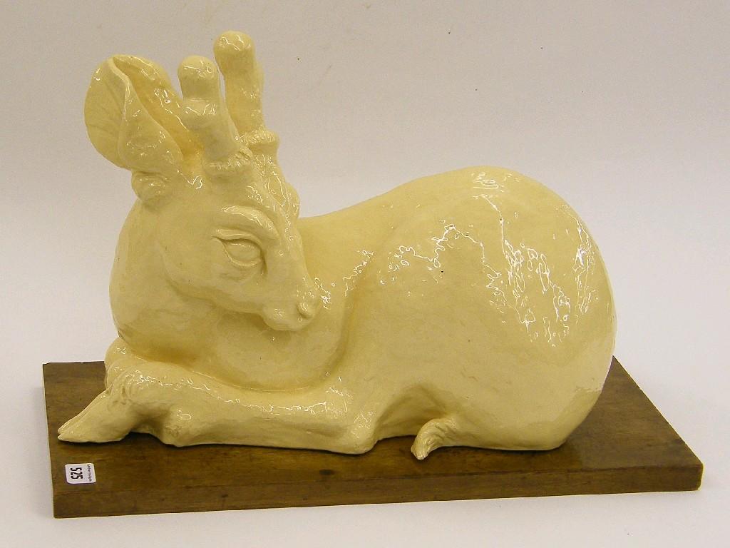 Appraisal: Glazed th century pottery figure of a recumbent stag upon